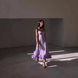 Elegant lavender A-line evening dress with ruffled skirt and adjustable spaghetti straps