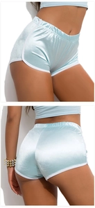 Detail of light blue satin sports shorts with white contrast binding and glossy texture