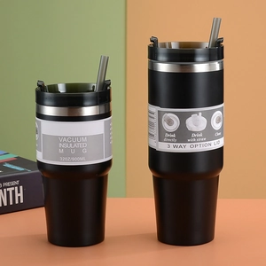 Macro detail of black 32oz vacuum insulated travel mugs with 3-way lid and straw