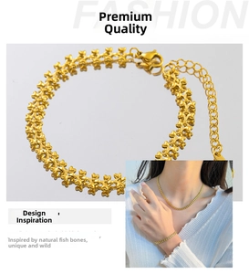 Detail of gold-plated fishbone chain necklace and bracelet with lobster clasp