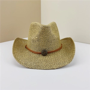 Close-up of woven straw cowboy hat with brown cord band and vintage bronze buckle