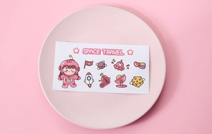 Cute pink space stickers with astronauts and rockets on a matching display tray