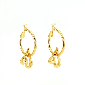 Chic gold titanium steel hoop earrings with asymmetric heart charms on white background