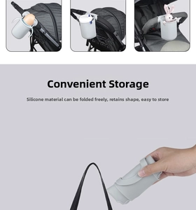 Detail of flexible light grey silicone cup holder showing folding durability for strollers