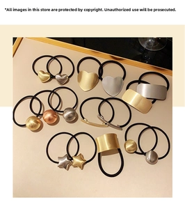 Detailed set of elastic hair ties with brushed metal beads and geometric charms