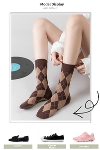 Close-up of brown Argyle patterned crew socks with ribbed cuffs for women