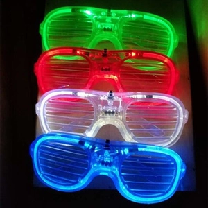 Four LED glowing shutter glasses in green, red, white, and blue for 2026 party celebration