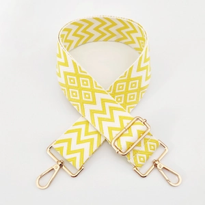 Detail of adjustable 5cm wave pattern bag strap with gold metal rotating hooks