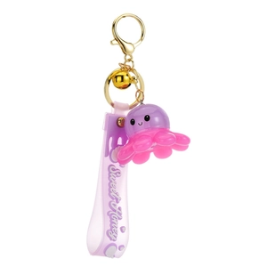 Adorable purple resin octopus keychain with a Sweet Honey strap and gold bell accessory
