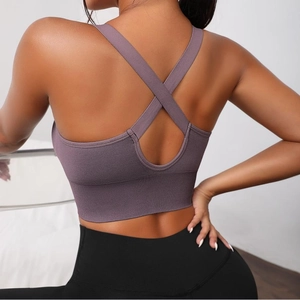 Close-up of purple seamless yoga bra with stylish criss-cross back straps design