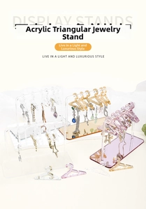 Acrylic earring stand with miniature hangers in clear, gold, and purple mirror finishes
