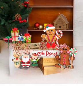 Detailed view of handcrafted wooden Christmas tabletop decor with gingerbread man and deer