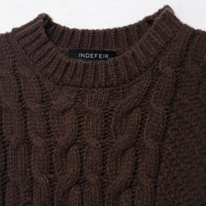 Deep brown cable knit sweater with chunky round neck design for a warm and stylish look