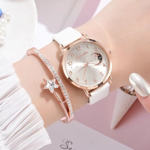 Detailed view of rose gold quartz watch with moon dial and star charm bracelet