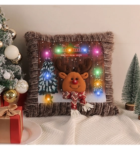 Close-up of LED glowing Christmas pillow cover with 3D reindeer doll and velvet trim
