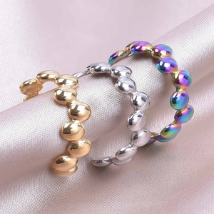 Three-piece stainless steel bubble ring set in gold, silver, and rainbow chrome finishes