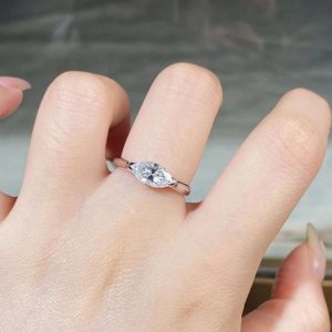Close-up of model wearing 925 silver ring with marquise-cut moissanite stone