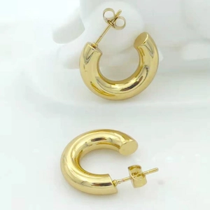 Polished gold hollow C-shaped stainless steel hoop earrings with secure butterfly backs