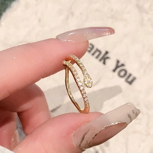 Elegant gold snake ring with pavé cubic zirconia gemstones in an adjustable open design
