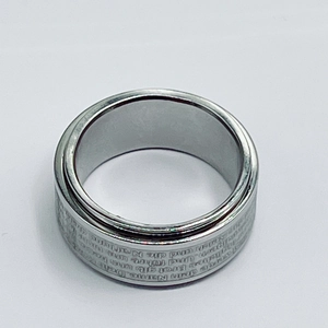 Rotating stainless steel spinner ring featuring engraved Christian Lord's Prayer text