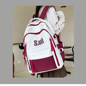Retro American collegiate style backpack in white and burgundy with SJM letter print