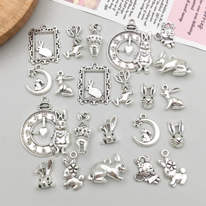 Detailed flat lay of antique silver zinc alloy rabbit charms for DIY jewelry making