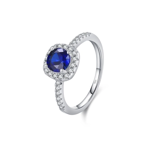 Luxurious S925 sterling silver ring with sparkling round blue gemstone and halo accents