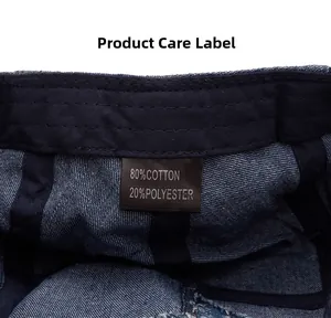 Detailed view of the internal care label on the vintage washed denim newsboy cap