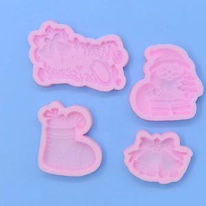 Pink silicone Christmas baking mold set featuring Santa, stocking, bells and Merry Christmas