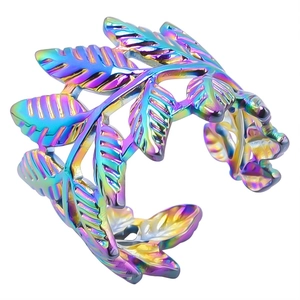 Macro shot of colorful iridescent stainless steel leaf ring with detailed leaf vein textures