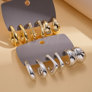 6-pair set of minimalist geometric gold and silver hoop earrings on display cards