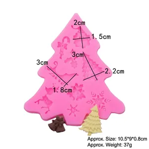 Pink silicone Christmas mold with Santa, reindeer, and snowflake shapes for cake decoration