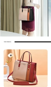 Detail of multi-color tote bag featuring neutral blocks and polished metal hardware