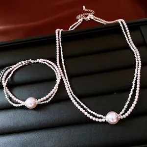 French vintage pearl and rhinestone jewelry set with layered necklace and bracelet