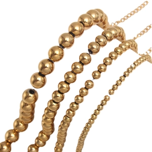 Golden stainless steel beaded bracelets in four bead sizes with adjustable chain clasps