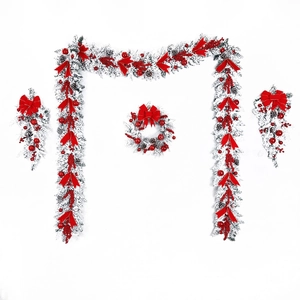 Christmas flocked wreath and garland set with red berries and bows for home decor