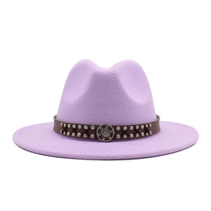 Detail of lavender felt fedora hat featuring brown leather band and silver rivets