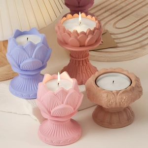Detailed view of layered lotus-shaped scented candles with vertical ribbed base designs