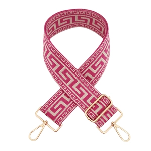 Detailed view of the rose red geometric jacquard strap with gold-tone metal clips