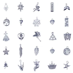 Detailed close-up of 25 silver alloy charms including hearts, leaves, and crowns for DIY jewelry