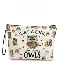 Macro view of canvas makeup bag featuring owl patterns and Just a girl who loves owls text