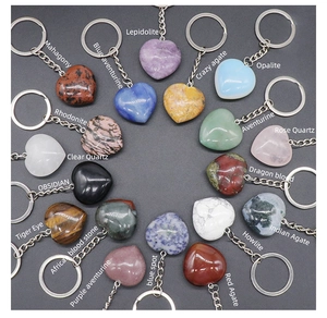 Collection of eighteen diverse gemstone heart keychains labeled by crystal material type