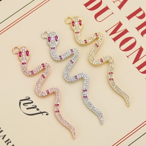 Set of three snake pendants in gold, silver, and rose gold with pavé cubic zirconia