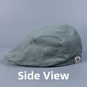 Side view of washed light blue denim duckbill cap with woven label and neat stitching