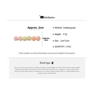 Detail view of 2cm rose flower stud earrings with imitation pearls and 9.7g weight