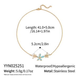 Detail of 18K gold plated necklace showing dimensions and light blue enamel flowers