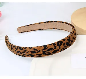 Detailed view of leopard print canvas headband with soft non-slip suede inner lining