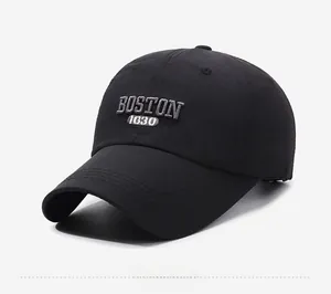 Detail of embroidered Boston 1630 letters on a black breathable quick-dry baseball cap