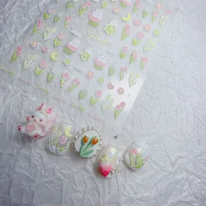 Detail of embossed rabbit nail stickers with floral tulip designs and 3D charms
