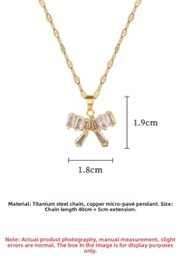 Macro view of gold bow pendant with zircon micro-paving and titanium steel chain detail